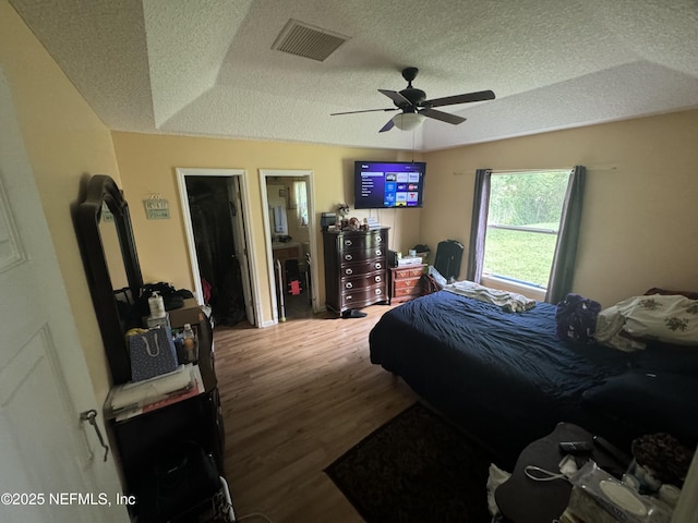 7071 Luke St, Jacksonville, FL 32210 - bedroom featuring a textured ceiling, visible vents, ceiling fan, and wood finished floors