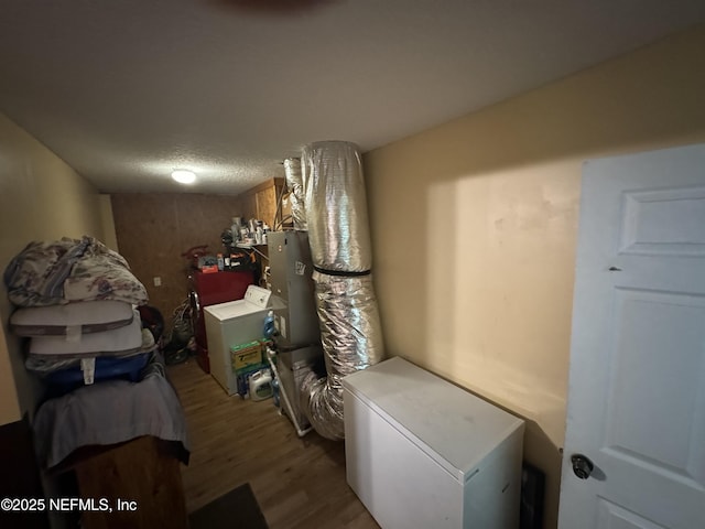 7071 Luke St, Jacksonville, FL 32210 - clothes washing area featuring washer / clothes dryer, a textured ceiling, laundry area, and wood finished floors