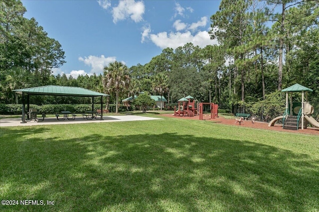 view of community featuring a lawn, a playground, and a gazebo