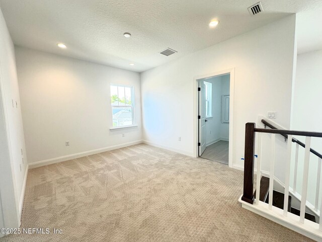 63 Oakmoss Dr, Saint Johns, FL 32259 - spare room with carpet floors, recessed lighting, and visible vents