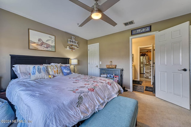 bedroom featuring carpet, stainless steel fridge, and ceiling fan