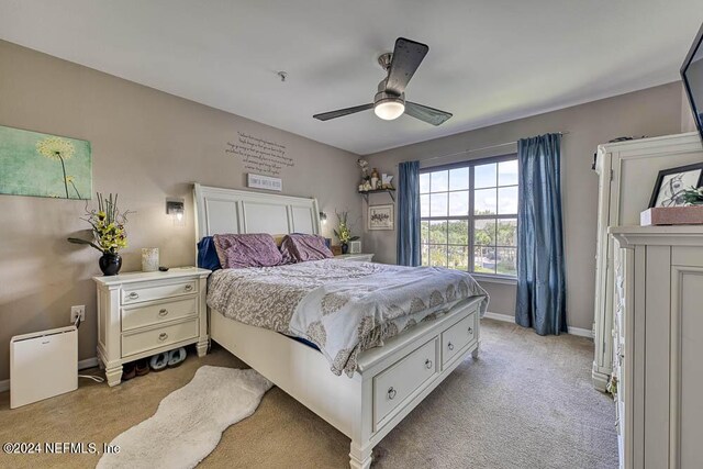 carpeted bedroom with ceiling fan