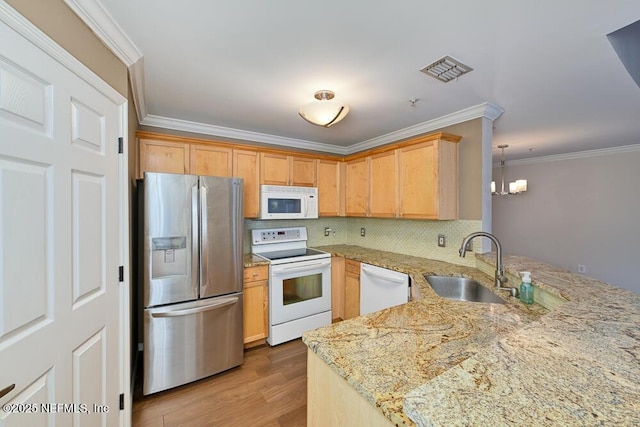 kitchen featuring light hardwood / wood-style flooring, sink, ornamental molding, white appliances, and light brown cabinetry