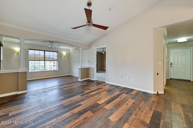 unfurnished living room with vaulted ceiling, decorative columns, ceiling fan, dark wood-type flooring, and ornamental molding