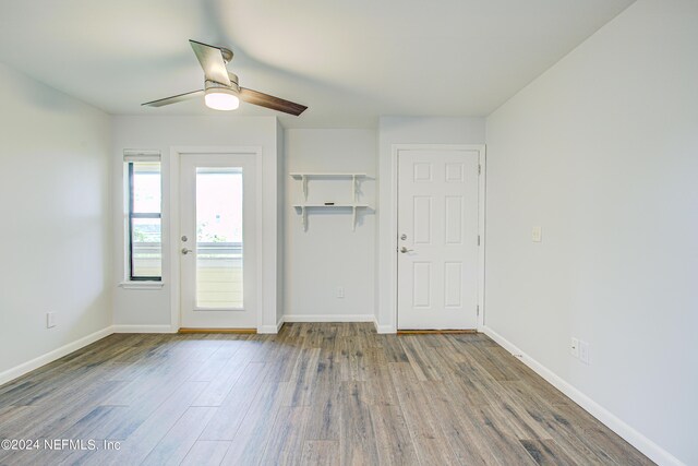 empty room featuring ceiling fan and light hardwood / wood-style floors