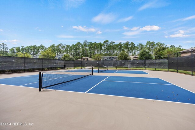 view of tennis court featuring basketball court