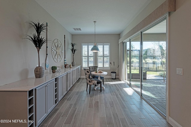 dining area with hardwood / wood-style flooring