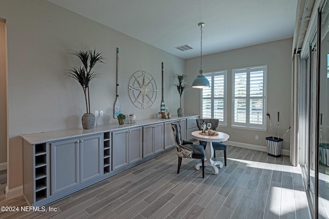 dining space featuring dark wood-type flooring