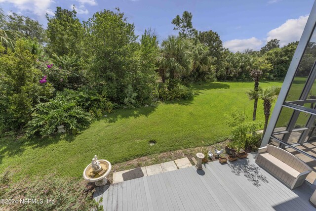 view of yard featuring a wooden deck