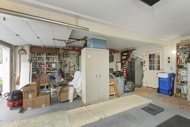 garage featuring stainless steel fridge