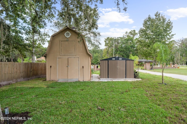 view of outbuilding featuring a yard