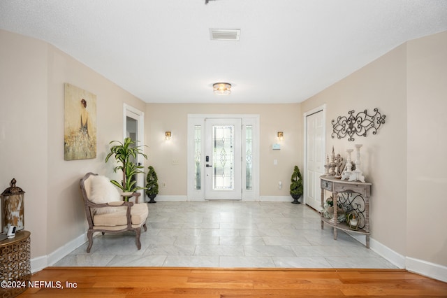 entrance foyer with light tile patterned floors