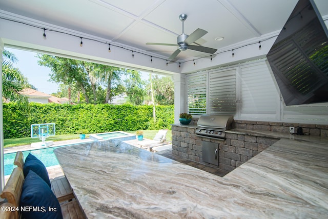 view of patio / terrace with area for grilling, ceiling fan, a fenced in pool, and a grill