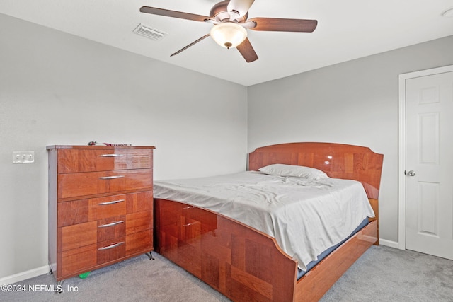 bedroom featuring ceiling fan and light colored carpet