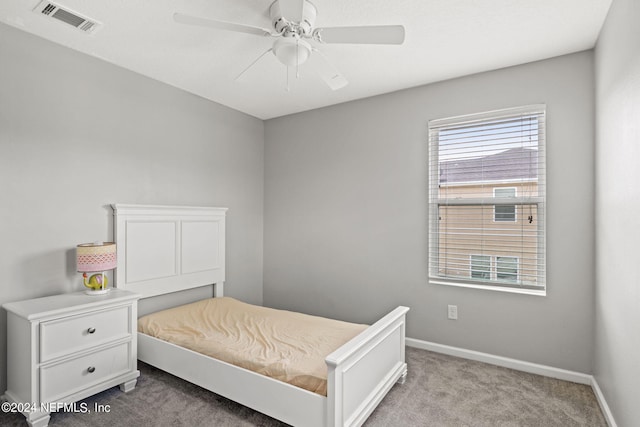 carpeted bedroom featuring ceiling fan