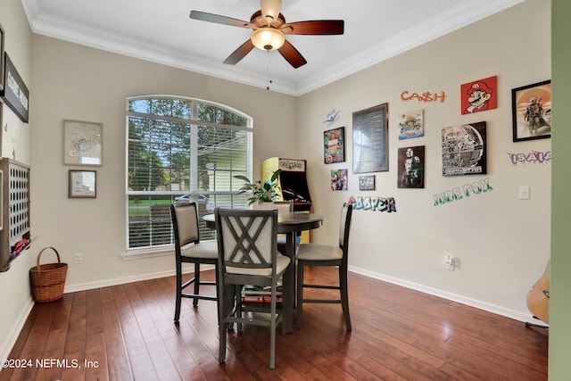 dining space with ornamental molding, ceiling fan, and dark hardwood / wood-style floors