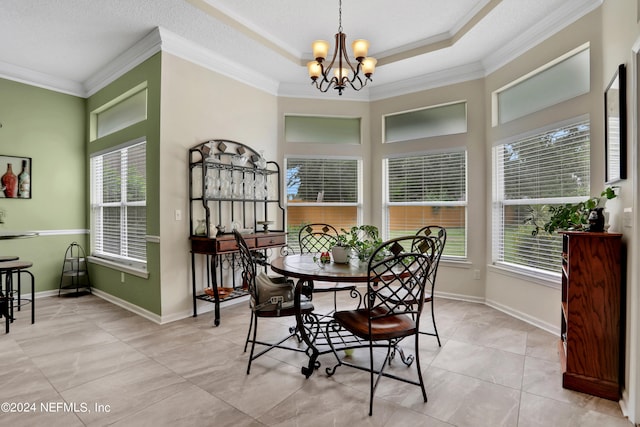 dining space featuring ornamental molding, a notable chandelier, light tile patterned floors, and a textured ceiling