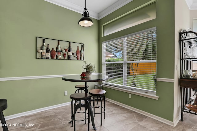 dining area featuring ornamental molding