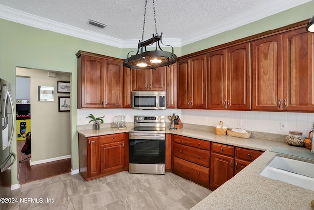 kitchen featuring backsplash, a textured ceiling, appliances with stainless steel finishes, pendant lighting, and ornamental molding