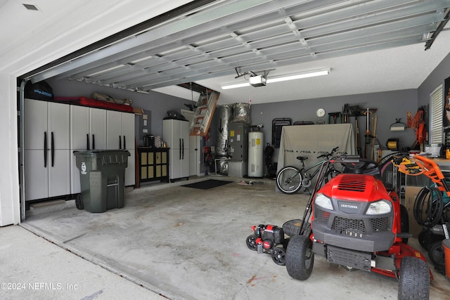 garage featuring water heater and a garage door opener