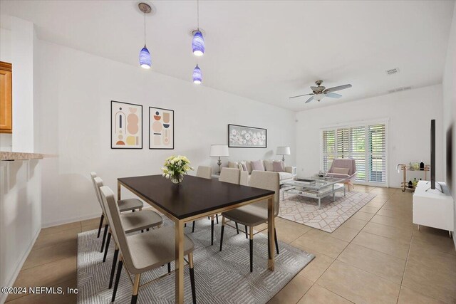 tiled dining room with ceiling fan