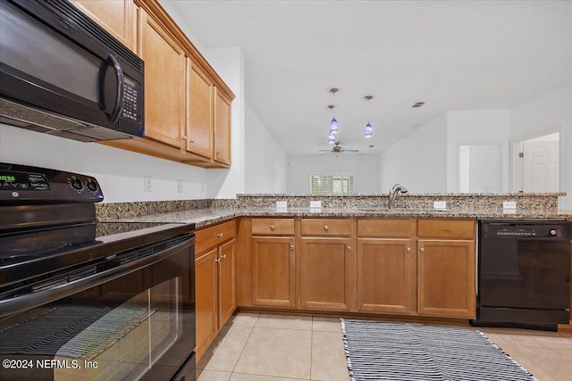 kitchen with kitchen peninsula, light stone countertops, light tile patterned floors, black appliances, and ceiling fan