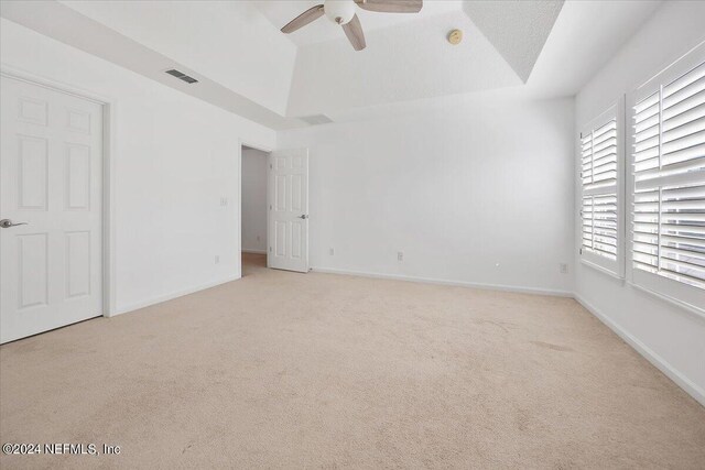 interior space with vaulted ceiling and ceiling fan