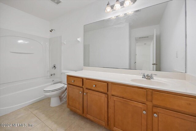 full bathroom featuring tub / shower combination, tile patterned flooring, vanity, and toilet