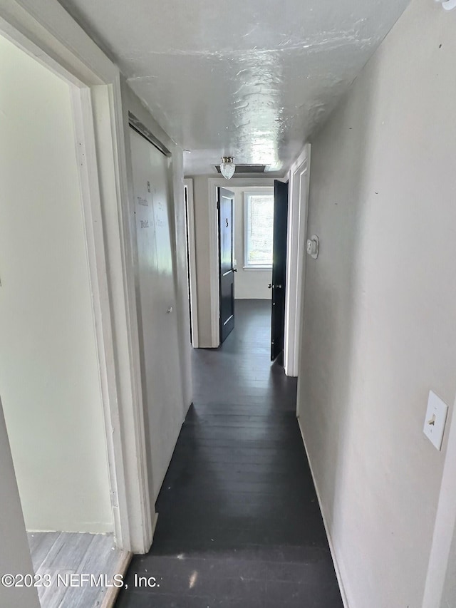 hallway featuring hardwood / wood-style flooring