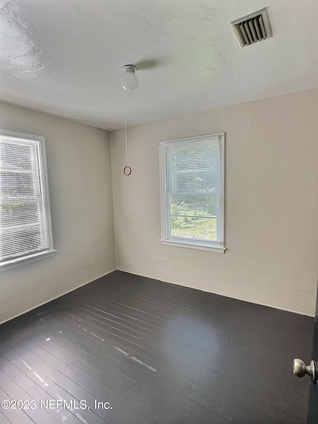 empty room featuring hardwood / wood-style floors