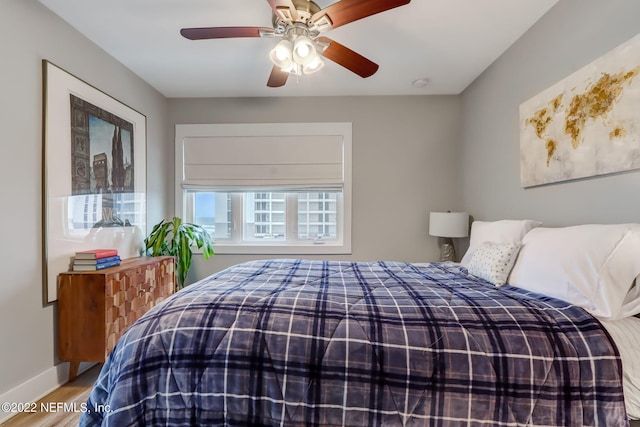 bedroom featuring ceiling fan and hardwood / wood-style floors