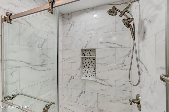 bathroom with an enclosed shower