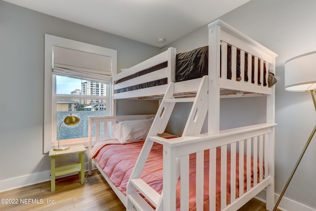 bedroom with wood-type flooring