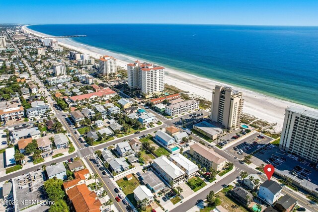 drone / aerial view featuring a view of the beach and a water view