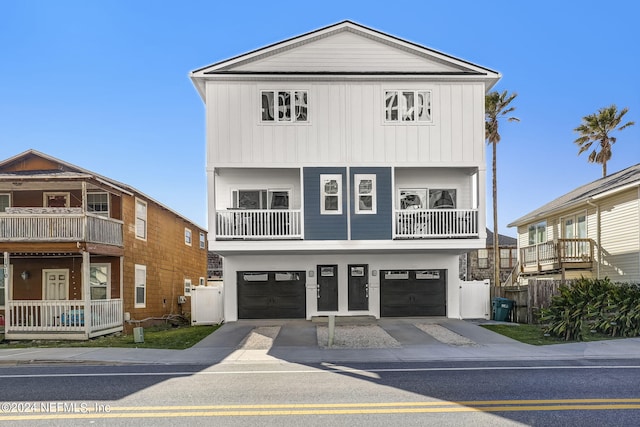 view of front of house featuring a balcony and a garage