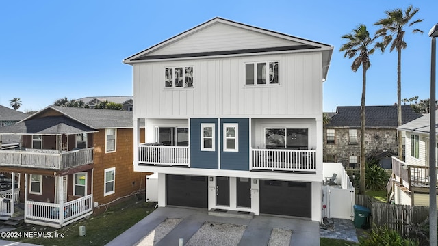 view of front of property with a garage and a balcony