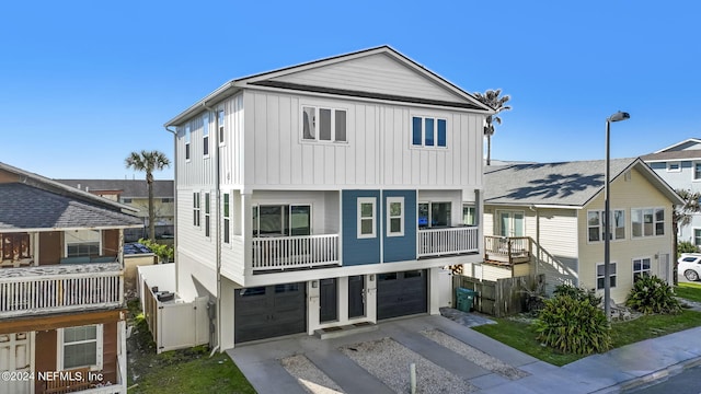 view of front of property with a balcony and a garage