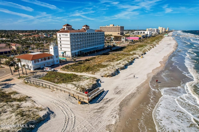 aerial view featuring a water view and a view of the beach