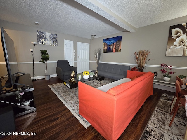 living room with dark wood-type flooring, beamed ceiling, and a textured ceiling