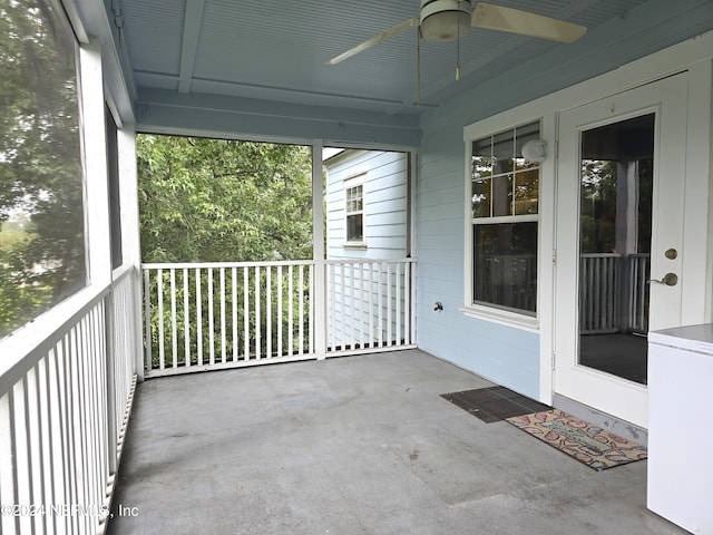 exterior space with ceiling fan