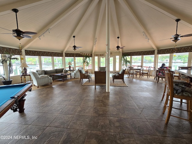 interior space featuring ceiling fan, pool table, and lofted ceiling with beams