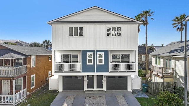 view of front of property featuring a garage and a balcony