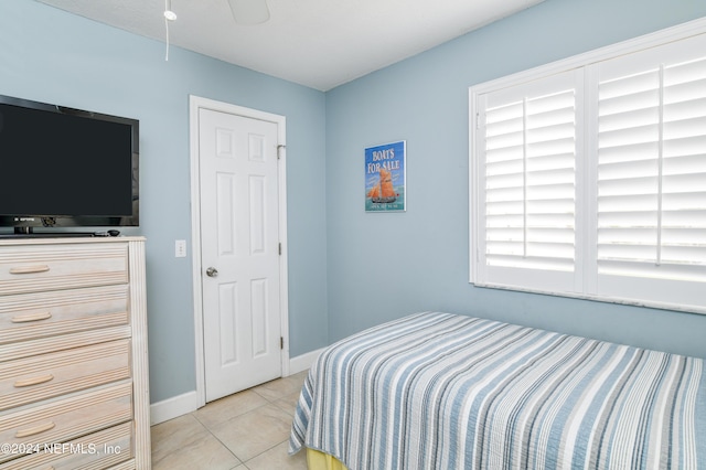 8550 A1A Unit 241, Saint Augustine, FL 32080 - bedroom with light tile patterned flooring, baseboards, and a ceiling fan