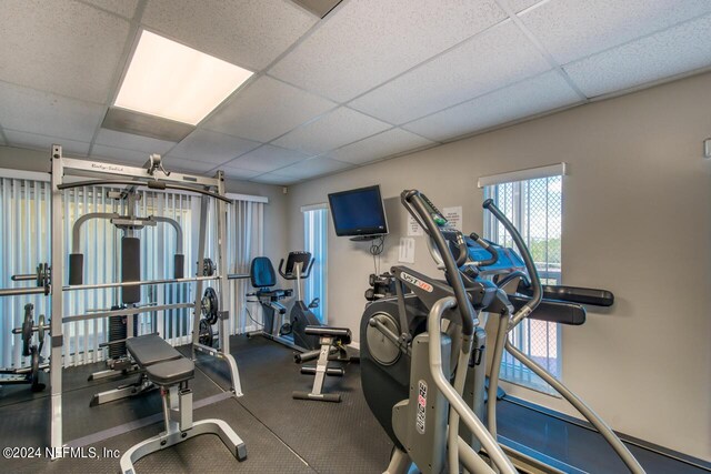 gym featuring a drop ceiling