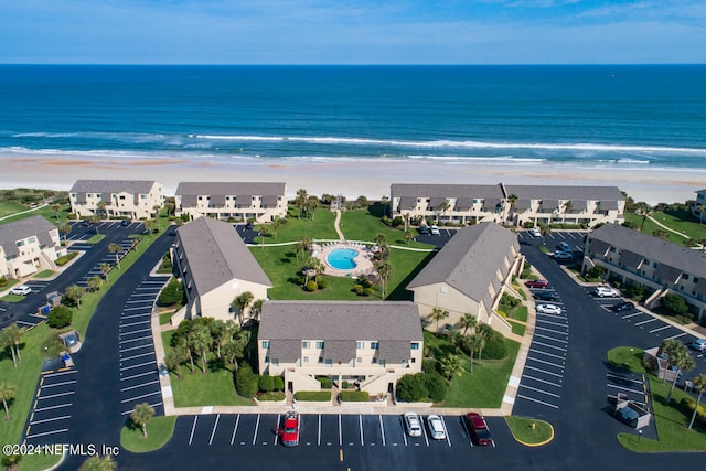 aerial view featuring a water view and a beach view