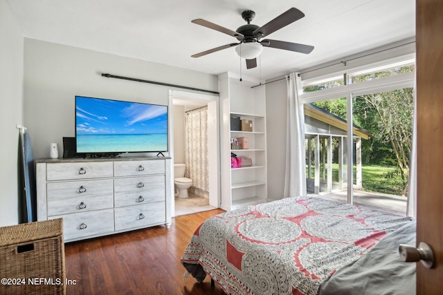 bedroom featuring access to outside, ceiling fan, connected bathroom, and dark hardwood / wood-style flooring