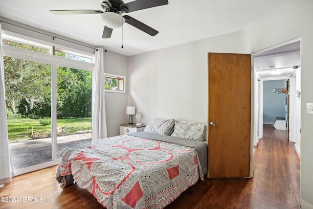 bedroom with dark hardwood / wood-style floors, access to outside, and ceiling fan