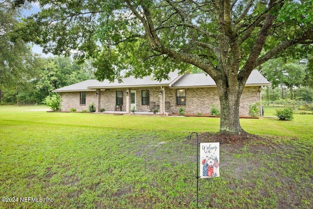 ranch-style house with a front lawn