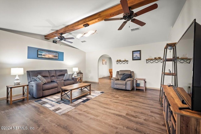 living room with ceiling fan, vaulted ceiling with beams, and hardwood / wood-style floors