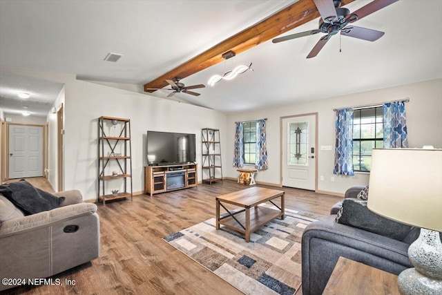 living room with beam ceiling, ceiling fan, and light hardwood / wood-style flooring